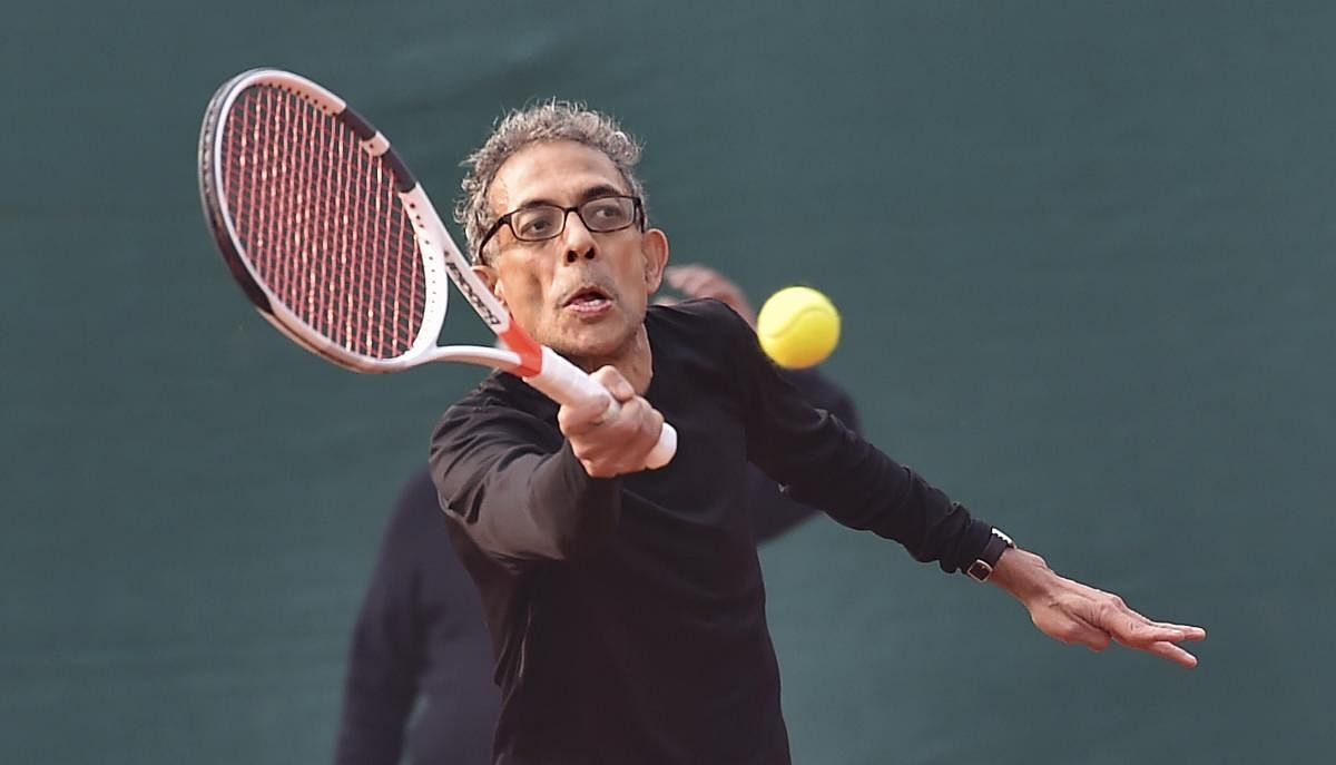 Nobel laureate and economist, Abhijit V Banerjee, playing tennis at a south club in Kolkata, Tuesday, Jan. 28, 2020. (PTI Photo)