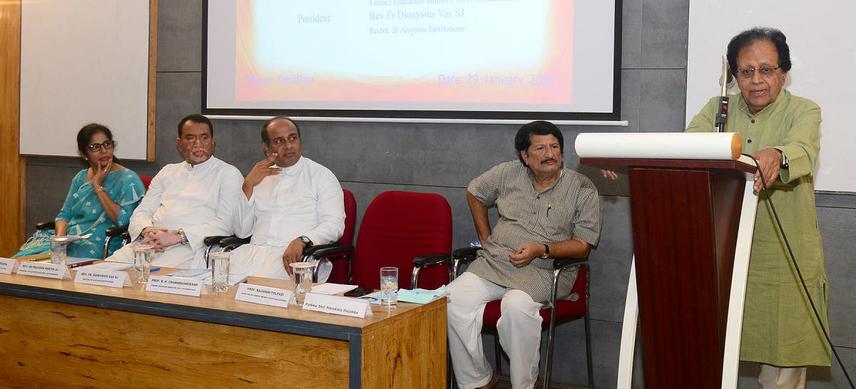 Former education minister Prof B K Chandrashekhar speaks during the inaugural session of the national seminar on ‘Debating Gandhi’ at St Aloysius College, Mangaluru, on Wednesday. St Aloysius Institutions Rector Fr Dionysius Vaz, St Aloysius College Principal Fr Pravin Martis and Nehru Chinthana Kendra Director Prof Rajaram Tholpadi look on.