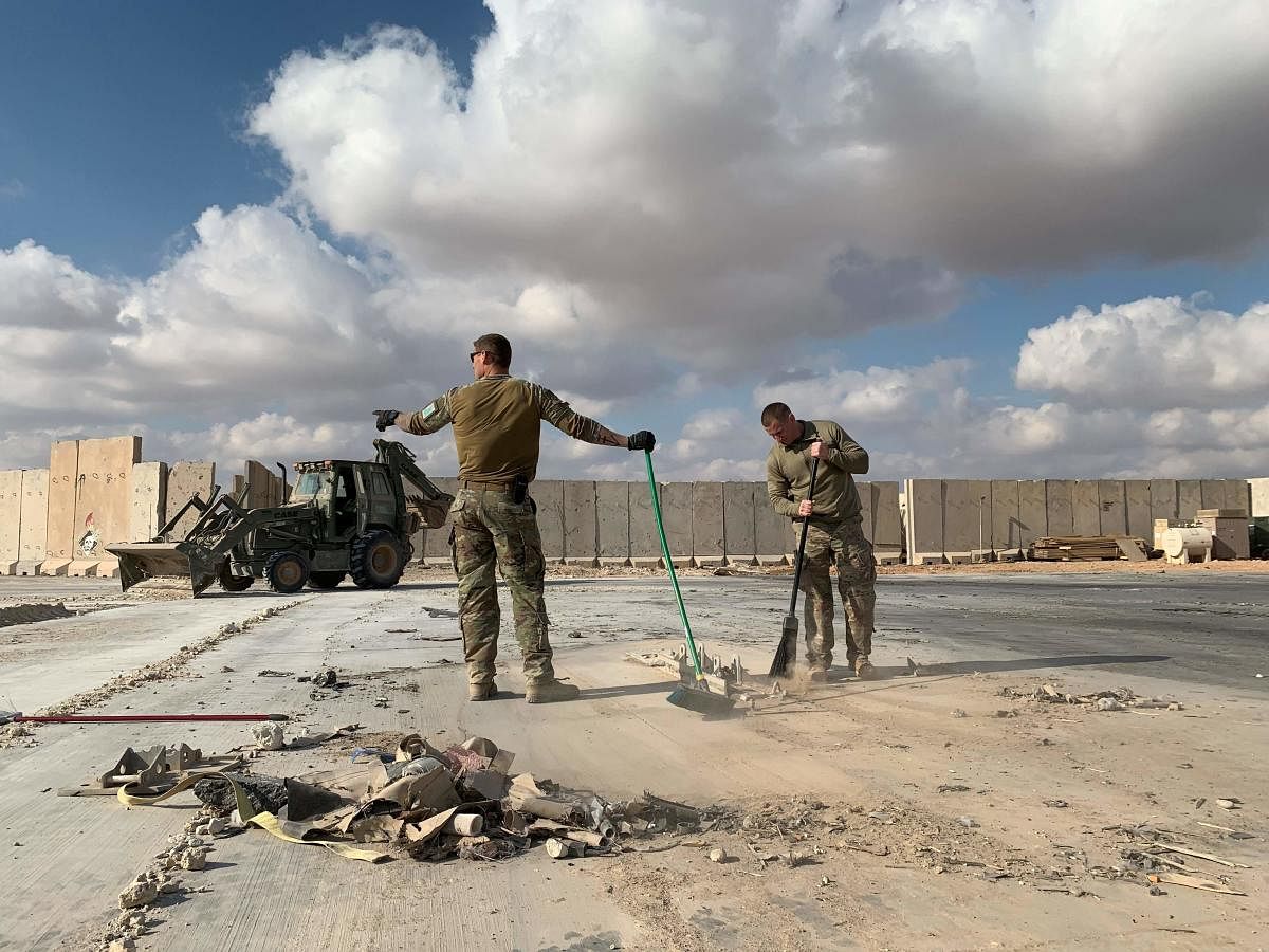  A file picture taken on January 13, 2020 during a press tour organized by the US-led coalition fighting the remnants of the Islamic State group, shows US soldiers clearing rubble at Ain al-Asad military airbase in the western Iraqi province of Anbar. Credit: AFP File Photo