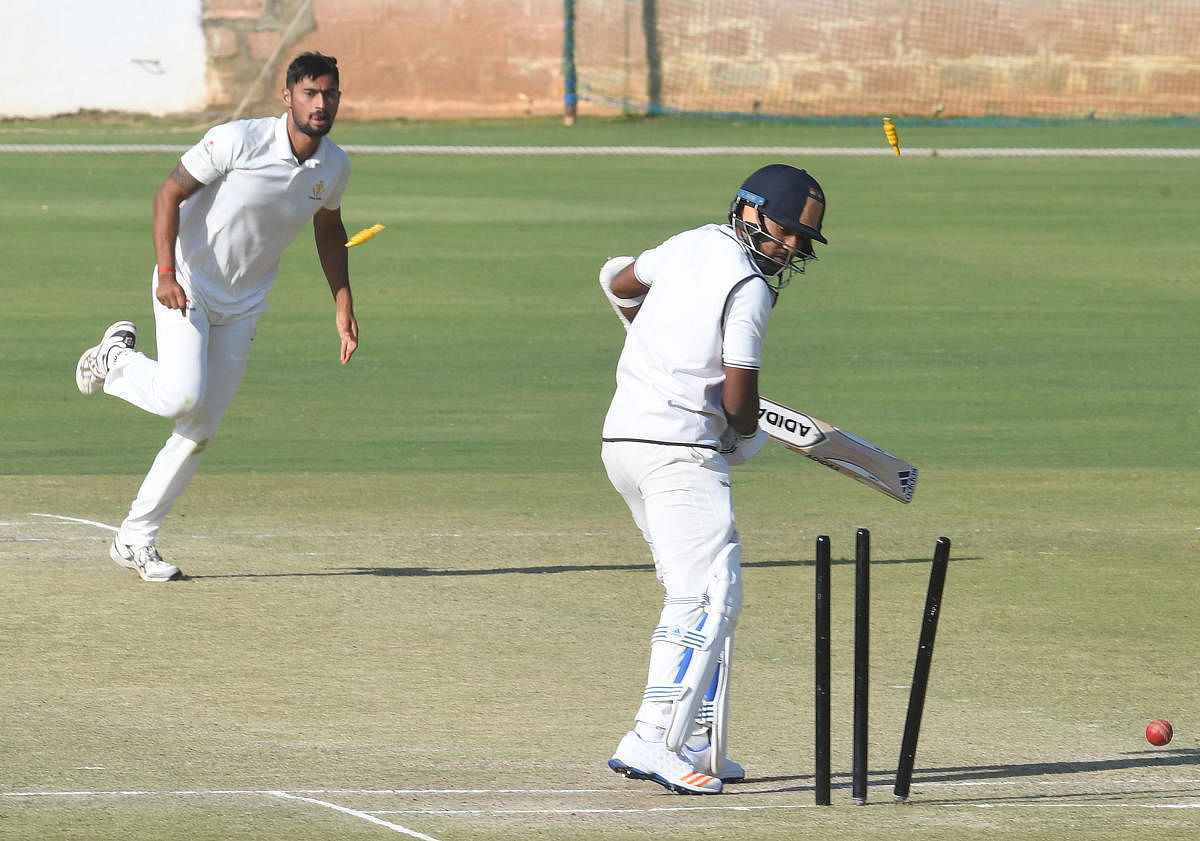 Karnataka paceman Ronit More (left) claimed 6/32 to fashion Karnataka's 10-wicket win over Railways in their Ranji Trophy match in New Delhi on Thursday. DH FILE PHOTO