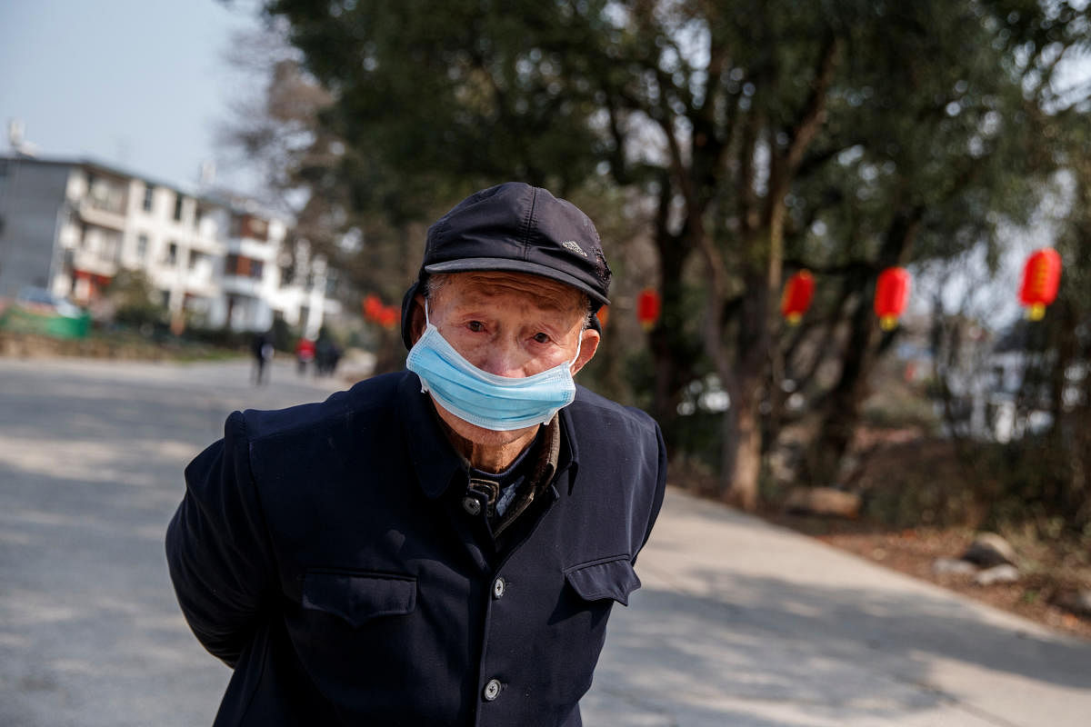 Man wears a face mask in a village outside Donglin Temple that is under lockdown because of the coronavirus outbreak in Jiujiang. Reuters