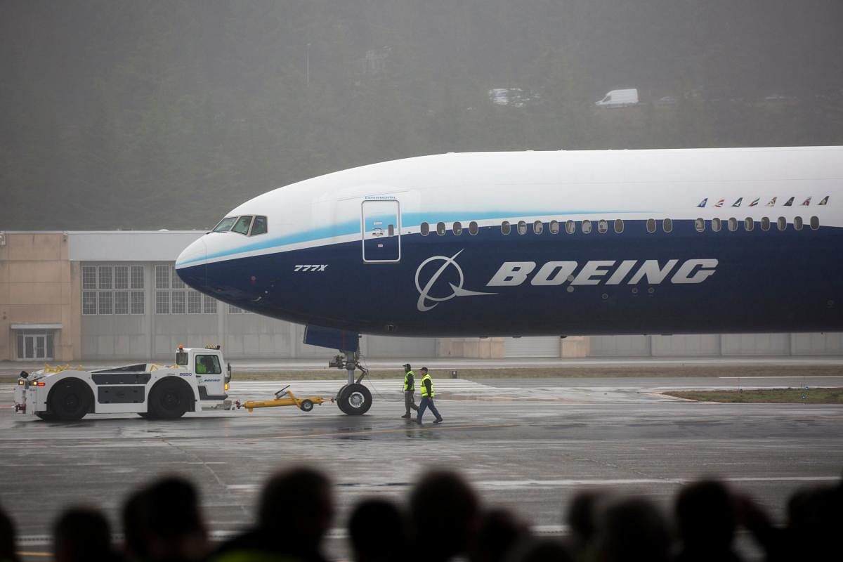 A Boeing 777X airplane returns from its inaugural flight at Boeing Field in Seattle, Washington on January 25, 2020. (AFP Photo)