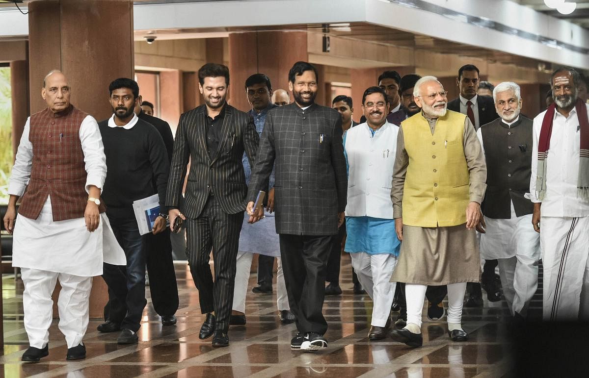 Prime Minister Narendra Modi with (L-R) Defence Minister Rajnath Singh, Lok Janshakti Party chief Chirag Paswan, Union minister Ram Vilas Paswan, Parliamentary Affairs Minister Pralhad Joshi and others after an all-party meet ahead of the Budget Session,