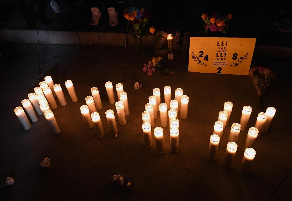  Candles spell out "KOBE" at a vigil held at UNLV as a tribute to nine victims killed in a helicopter crash. (AFP Photo)