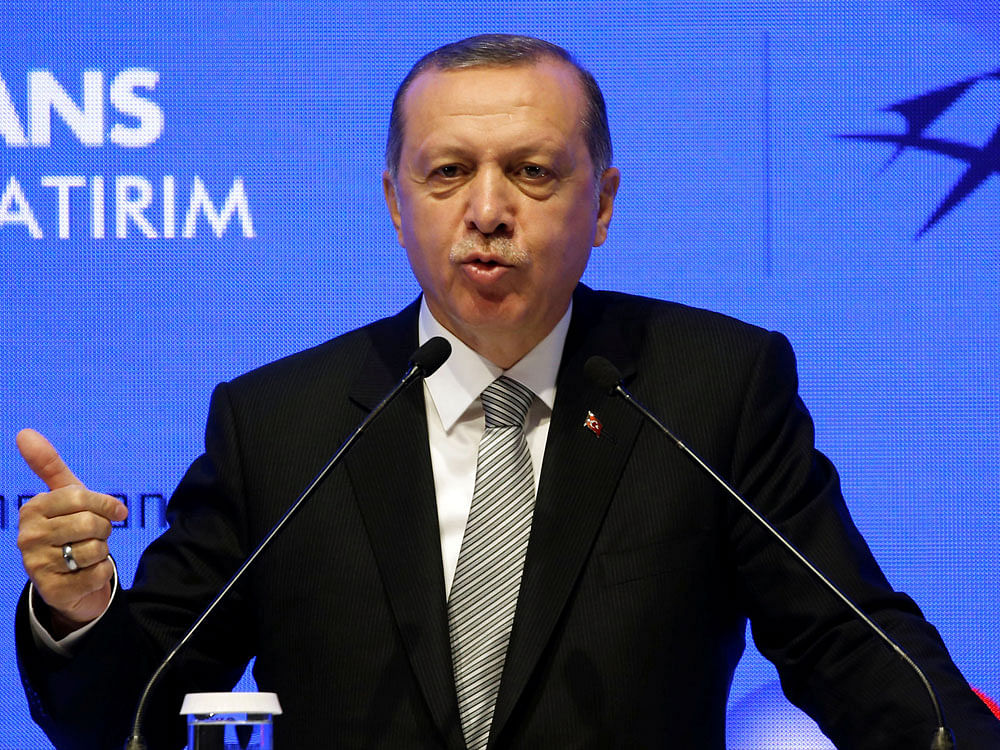 He also said Turkey "could not stand by as mere spectators as new threats come towards our borders". Reuters file photo