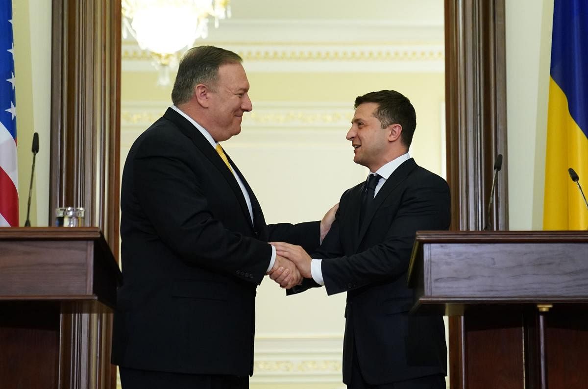 US Secretary of State Mike Pompeo and Ukraine's President Volodymyr Zelensky shake hands during a joint news conference in Kiev. AFP