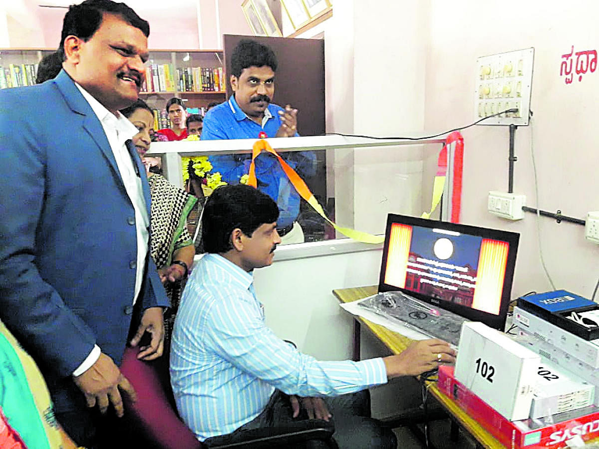 Udupi Deputy Commissioner G Jagadheesha inaugurates Digital Library Service, a first-of-its-kind initiative in the country, at Zilla Panchayat building in Udupi on Thursday.