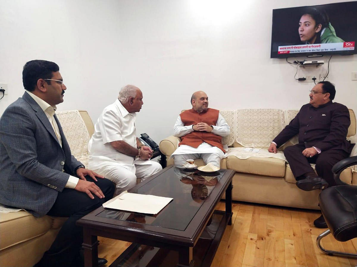 Chief Minister B S Yediyurappa holds talks with Union Home Minister Amit Shah and BJP national president J P Nadda, in New Delhi on Friday.