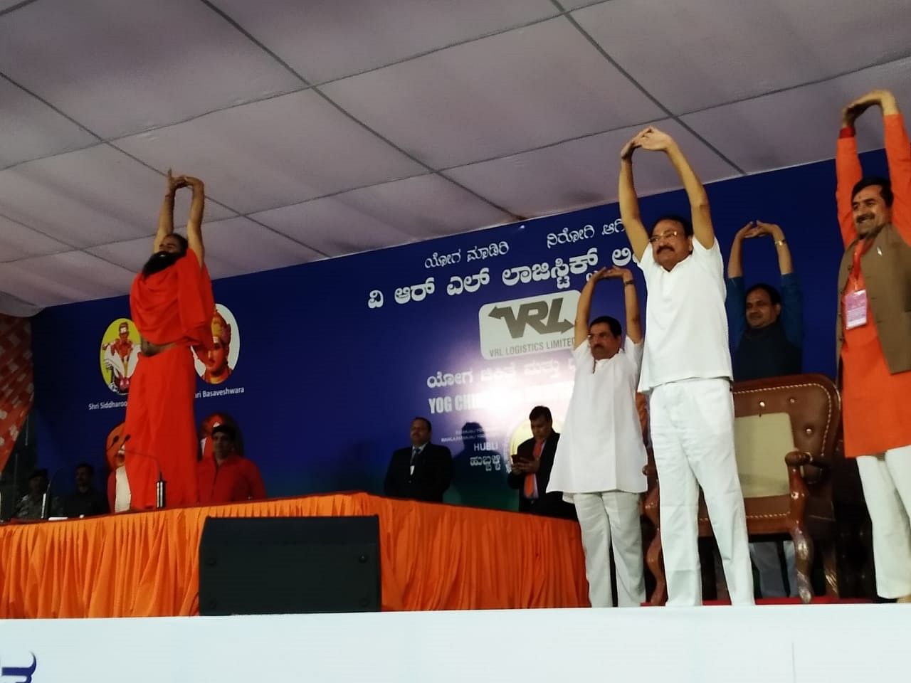 Naidu performs Yoga alongside Baba Ramdev (DH Photo)