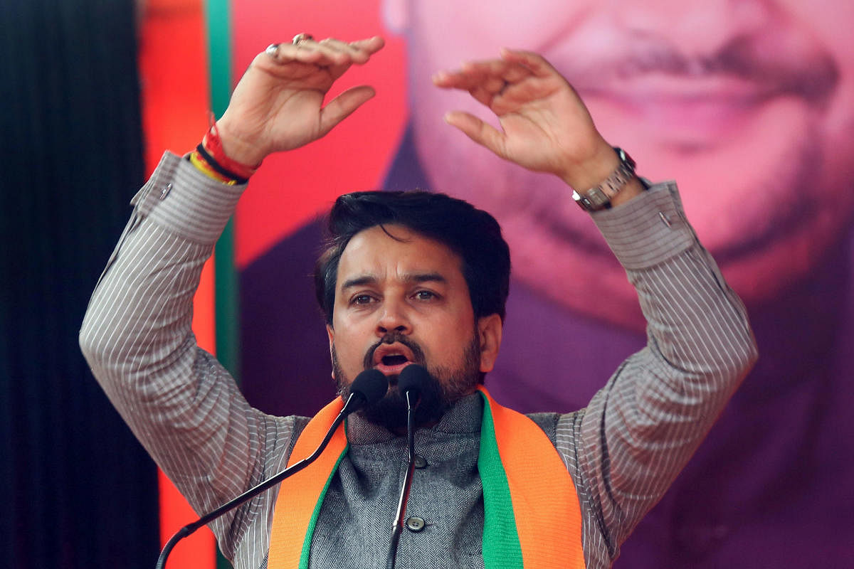 Thakur, Minister of State for Finance and Corporate Affairs who too was barred by the poll panel last week from participating in poll campaigns for 72 hours, was confronted by the Opposition with slogan 'goli marna band karo (stop shooting bullets)'. (PTI Photo)