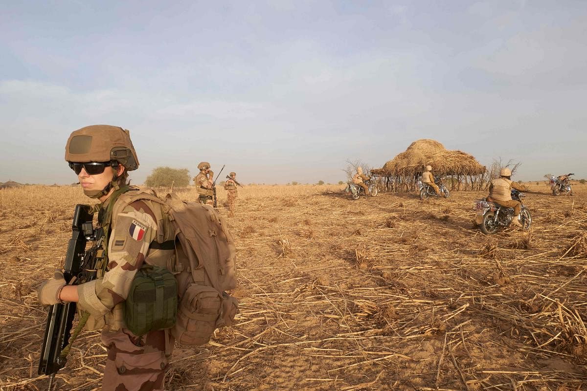 In this file photo taken on November 9, 2019 a soldier of the French Army patrols a rural area during the Barkhane operation in northern Burkina Faso. (AFP Photo)