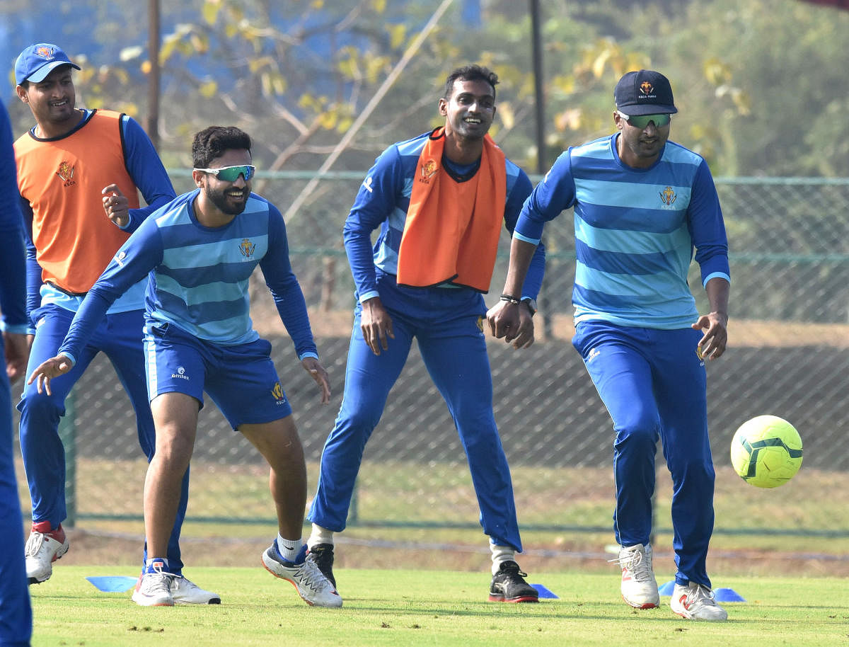 Pavan Deshpande, Karun Nair, A Mithun and K Gowtham (from left) during a practice session, ahead of their Ranji Trophy match against Madhya Pradesh in Shivamogga on Monday. DH Photo/ S K Dinesh