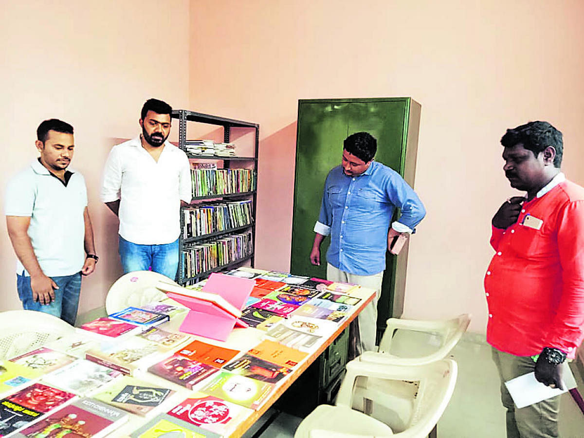 Library’s founder Ramesh (from right) seen with Head of Department, Nitte Institute of Communication, Prof Raviraj Kini and Darshan Jain of ACE Promoters and Developers who had recently visited the Library at Gundavupadavu Koraga colony near Bajpe old airport on the city’s outskirts.