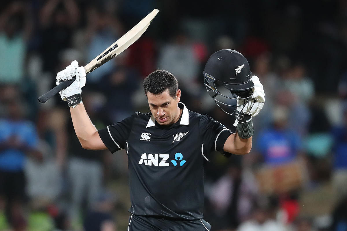 Ross Taylor celebrates his 100 runs during the first one-day international cricket match between New Zealand and India. (AFP Photo)