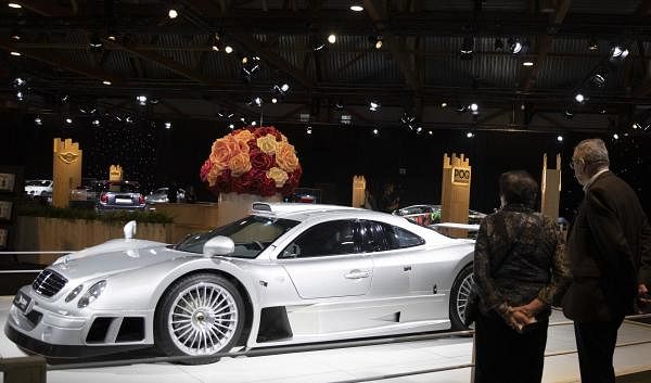 A couple view the Mercedes CLK GT R as part of the Dream Cars display during the Brussels Auto Show at the Expo in Brussels, Thursday, Jan. 9, 2020. (AP/PTI Photo)