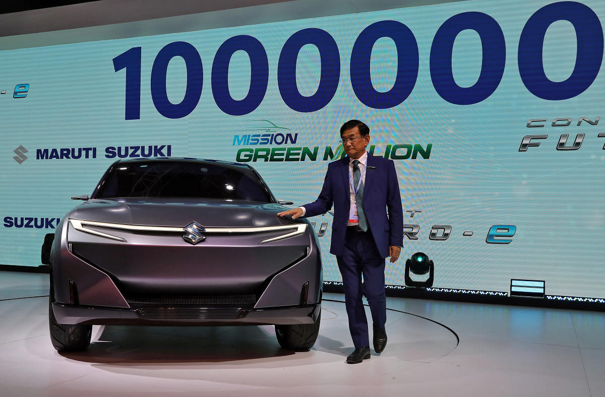 Kenichi Ayukawa, Chief Executive Officer of Maruti Suzuki India Ltd., poses with concept Futuro-e car after it was unveiled at the India Auto Expo 2020 in Greater Noida. Credit: Reuters Photo