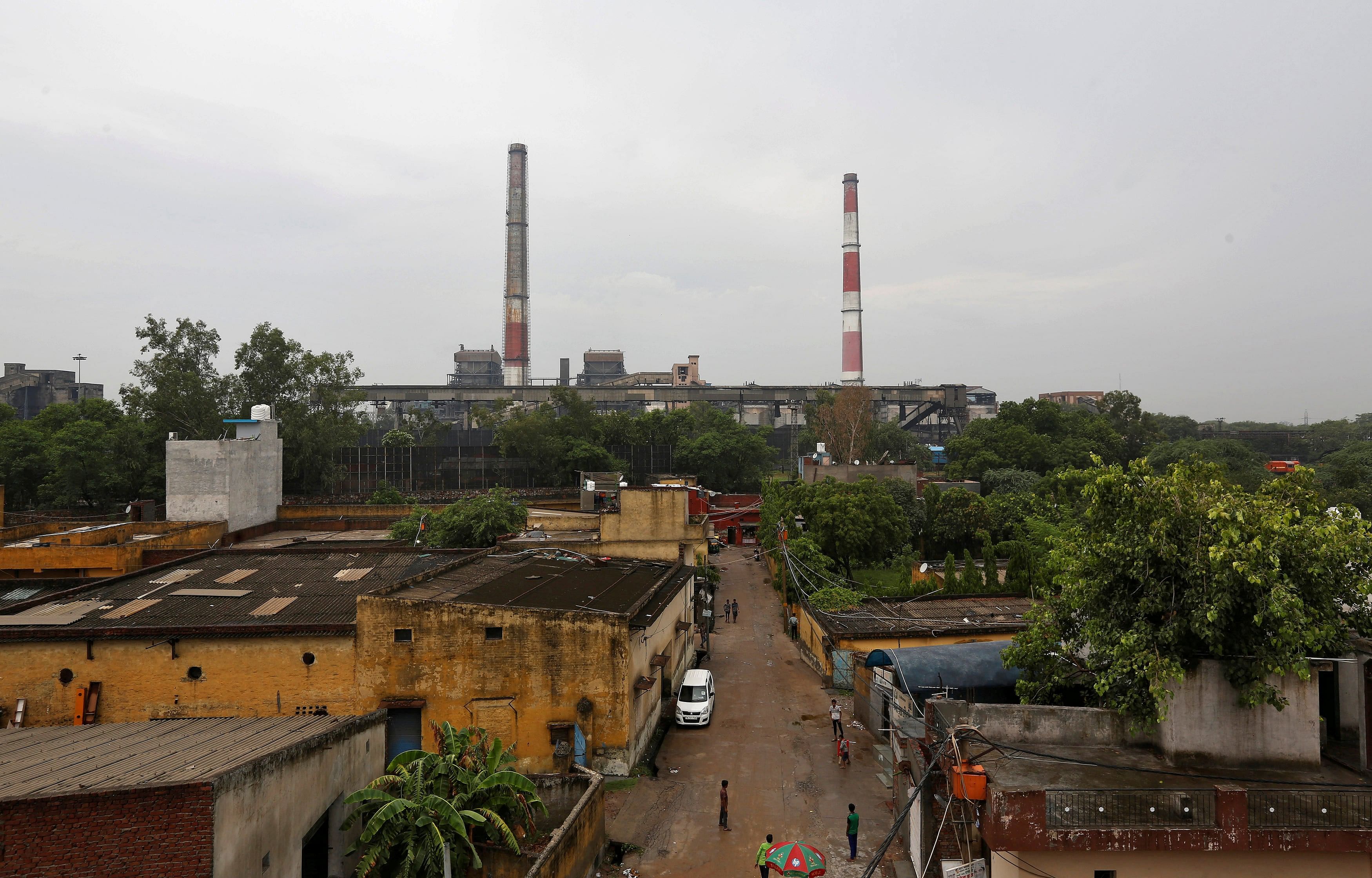 Chimneys of a coal-fired power plant are pictures in New Delhi, India, July 20, 2017. (Credit: Reuters Photo)