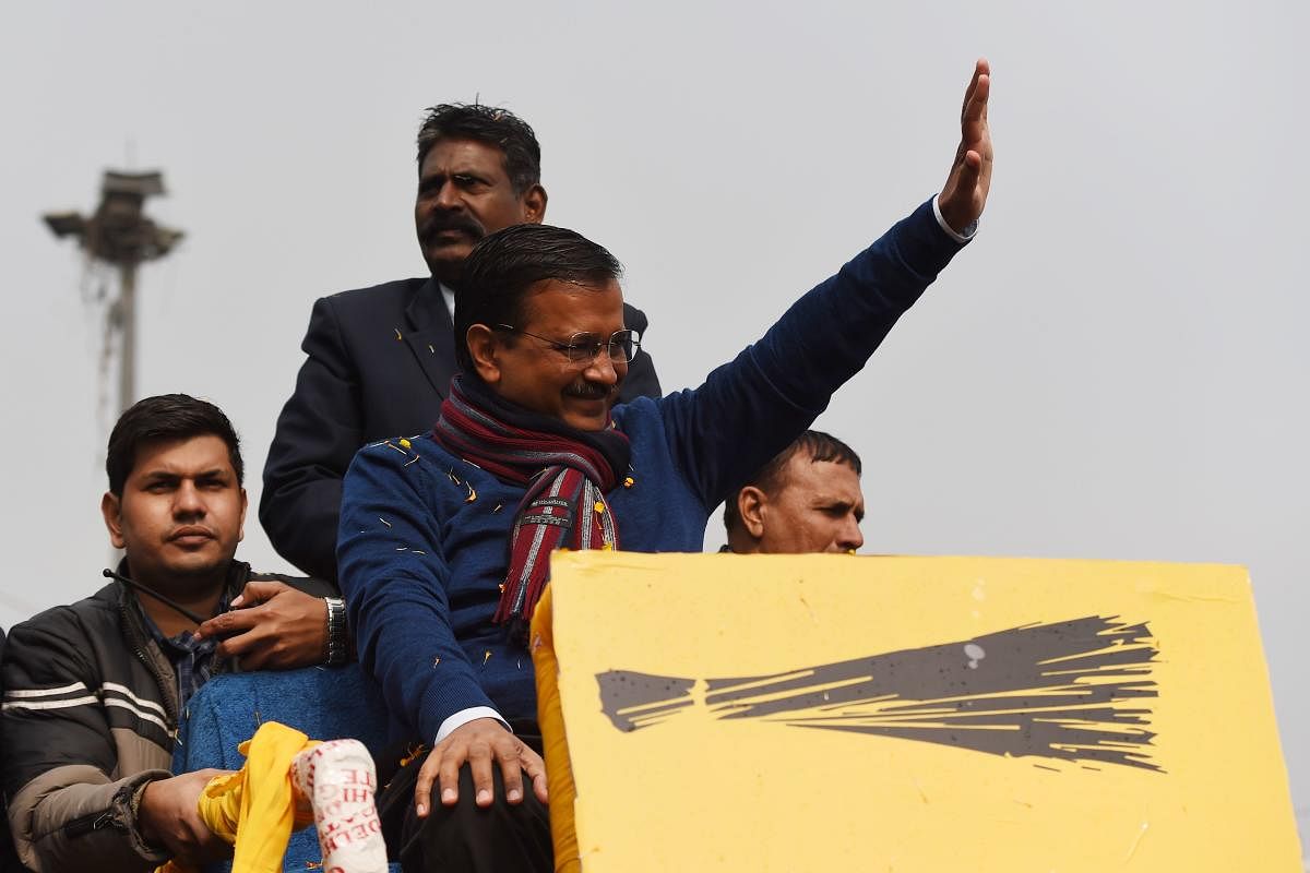 Chief Minister of Delhi Arvind Kejriwal (C) waves to his supporters during a road show for the upcoming Delhi Legislative Assembly election, in New Delhi on January 28, 2020. (AFP Photo)