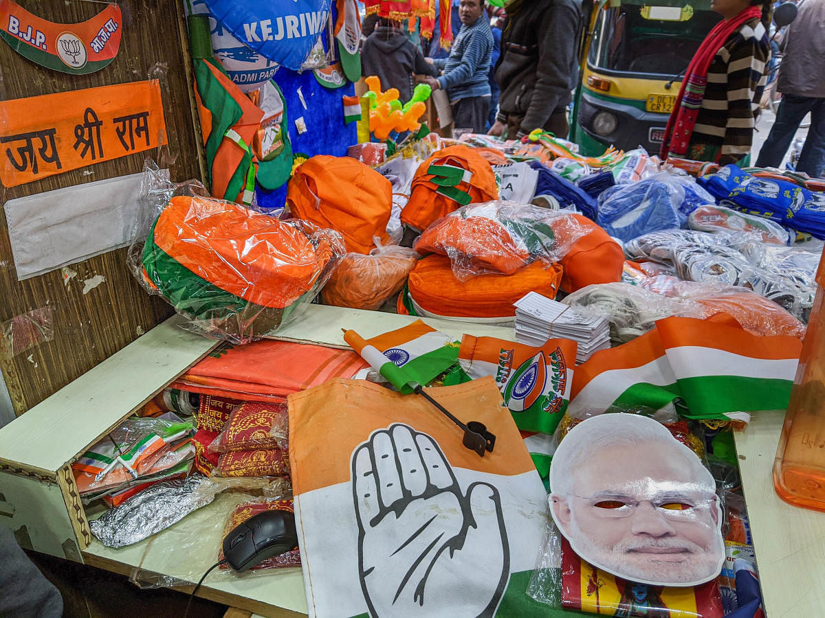 The campaign ended at 6 PM with candidates and workers of AAP, BJP and Congress criss-crossing the 70 constituencies, making their last contact with voters before entering into the silent campaign mode. (PTI Photo)