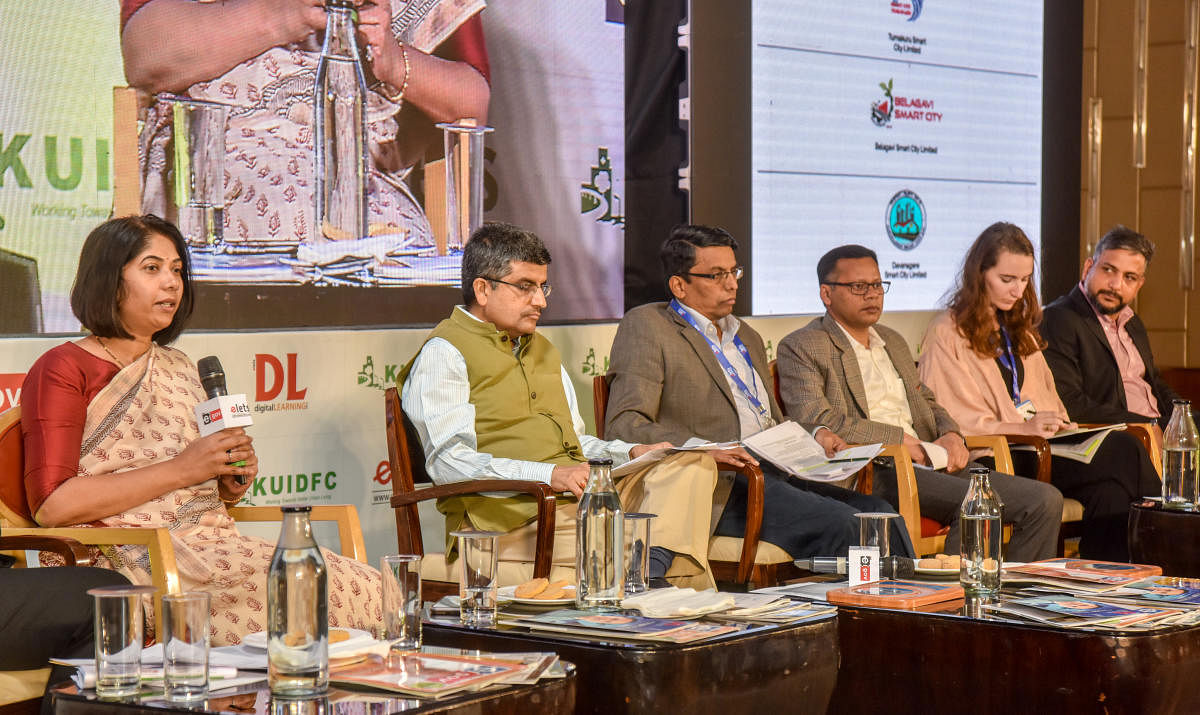 BMTC managing director C Shikha speaks at an interactive session on mobility at the Smart City Investor Summit on Wednesday. (From left) BMRCL managing director Ajay Seth, KSRTC managing director Shivayogi C Kalasad and others are seen. DH photo/Anup Ragh