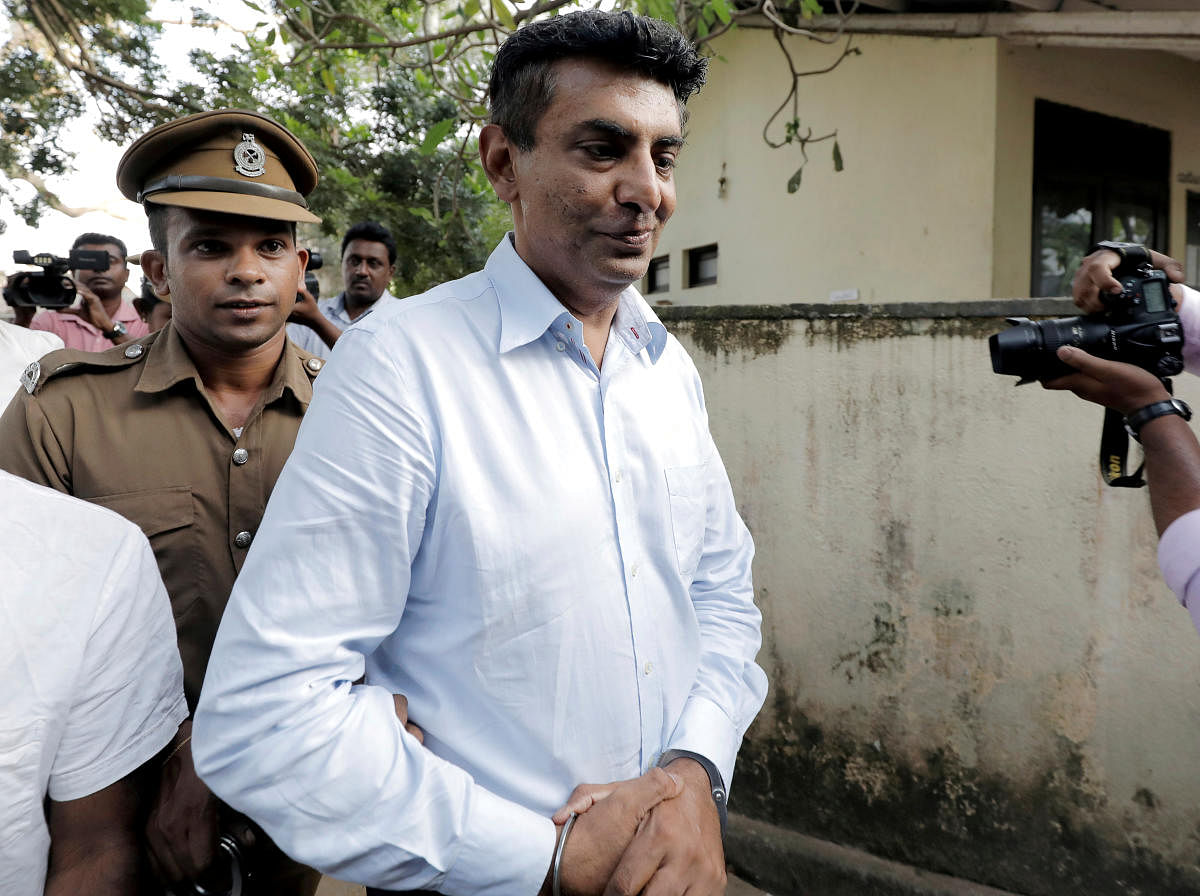 Former CEO of the SriLankan Airlines, Kapila Chandrasena leaves the court after being remanded in Colombo. Reuters