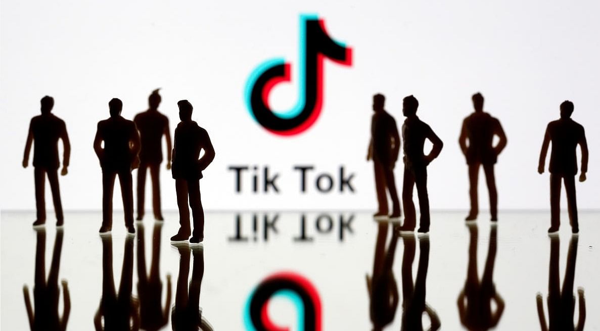 A 3-D printed figures are seen in front of displayed Tik Tok logo in this picture illustration (Credit:REUTERS/Dado Ruvic/Illustration)