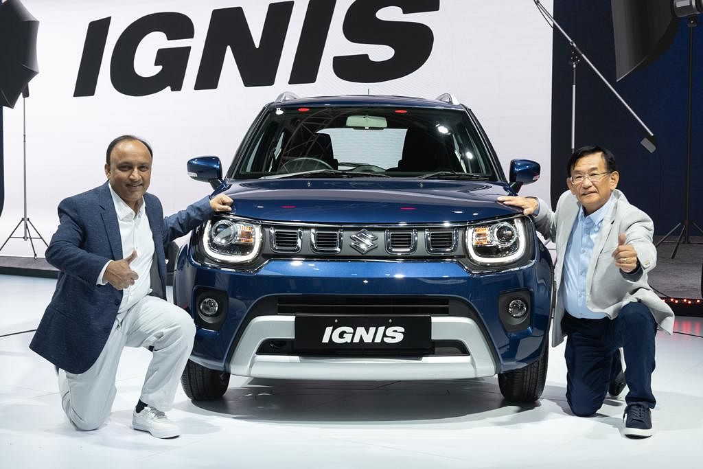 Maruti Suzuki MD and CEO Kenichi Ayukawa (right) and Shashank Srivastava, Executive Director, Marketing and Sales, during the unveil of the Ignis at the Auto Expo 2020 on Friday. Credit: DH Photo