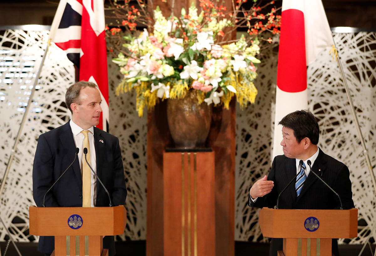 British Foreign Secretary Dominic Raab and Japanese Foreign Minister Toshimitsu Motegi attend their joint news conference after their meeting in Tokyo, Japan. Reuters