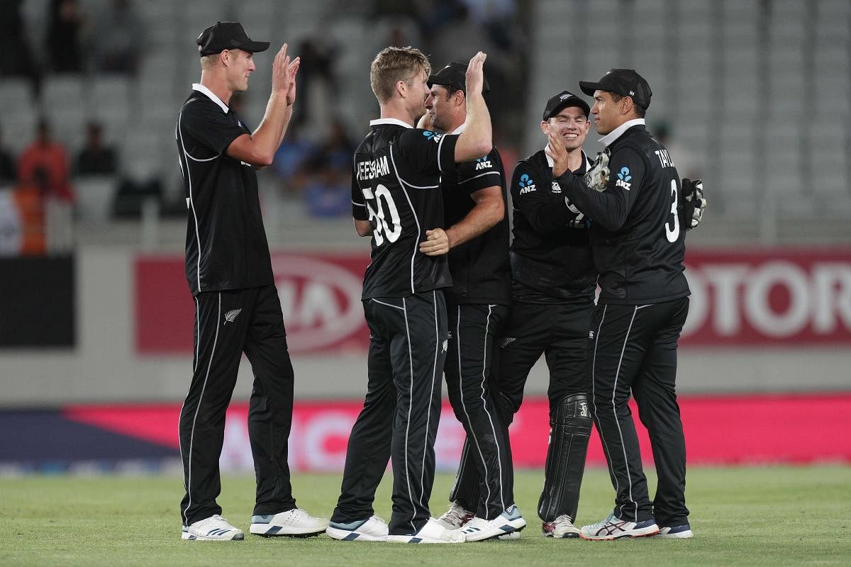 New Zealand players celebrate winning the second one-day international cricket match. (AFP Photo)