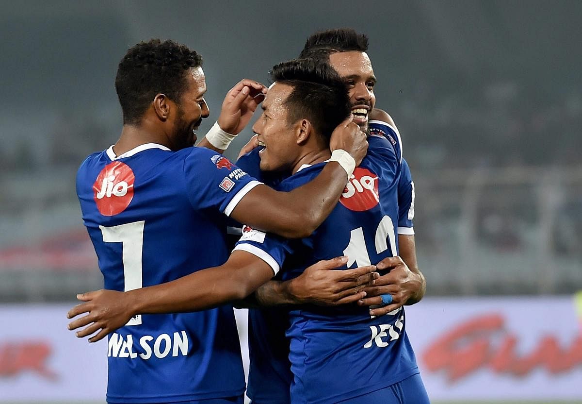 Chennaiyin FC forward Jeje Lalpekhlua(12) jubiliate with his teammates after scoring winning goal for his team against ATK during ISL match in Kolkata on Thursday.Chennaiyin FC won the match by 2-1. (PTI Photo)