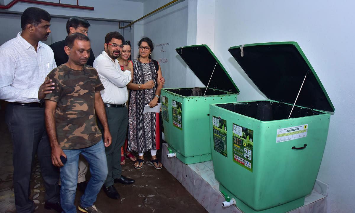 MCC Commissioner Ajith Kumar Hegde Shanady explains about the waste management bin at the apartment where he resides in Mannagudda.