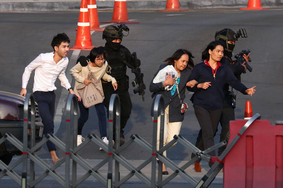 Thai security forces evacuate people stranded inside the Terminal 21 shopping mall following a gun battle, to try to stop a soldier on a rampage after a mass shooting, Nakhon Ratchasima. Reuters