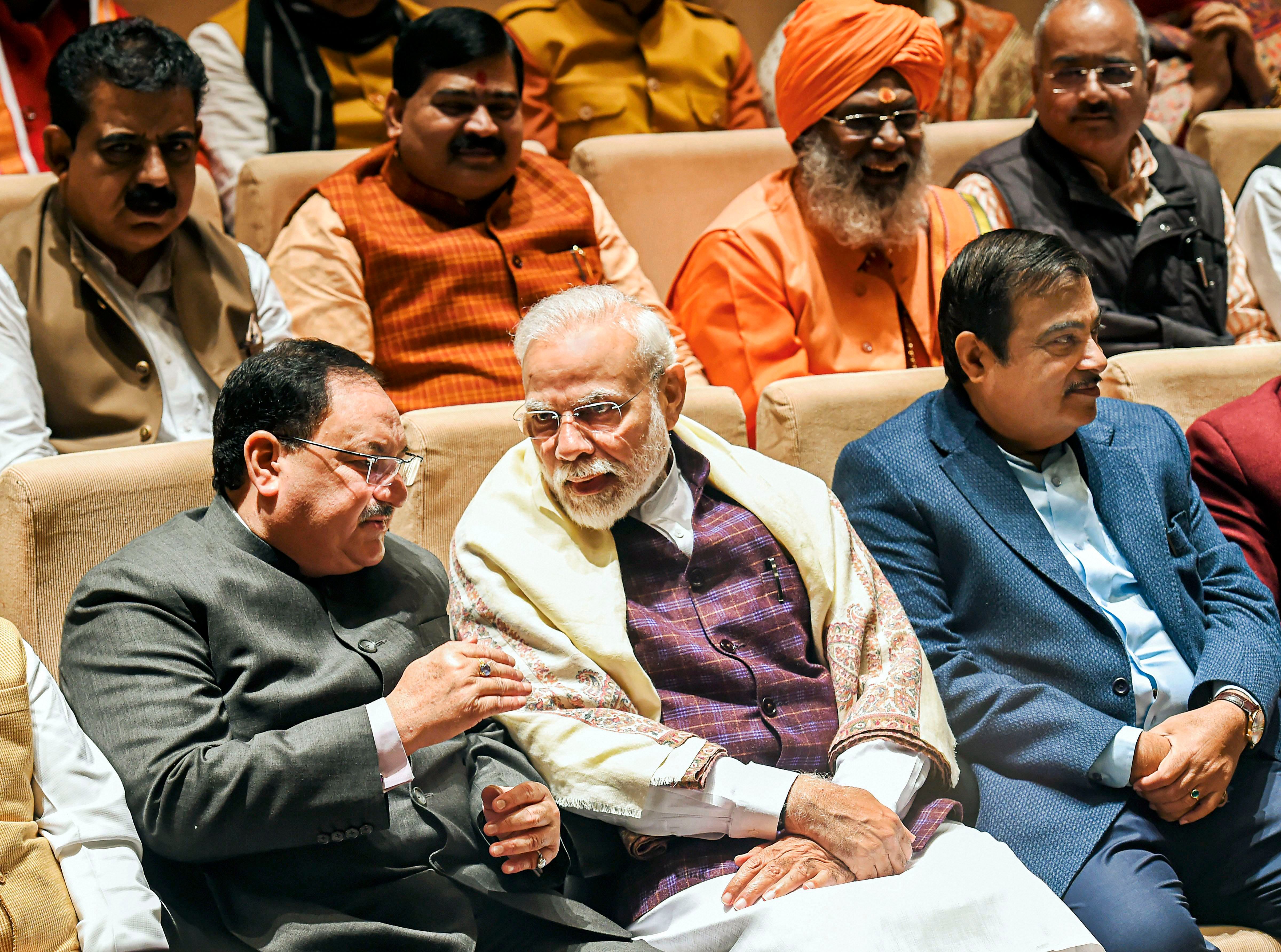 Prime Minister Narendra Modi (C), BJP National President JP Nadda (L) and Union Minister Nitin Gadkari. (PTI Photo)