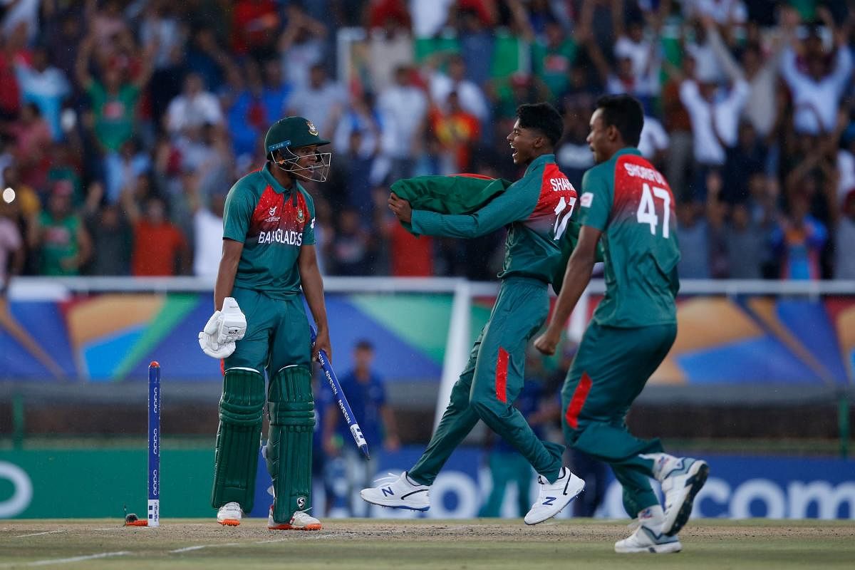 Bangladesh's Rakibul Hasan (L) celebrates with teammates after their victory over India during the ICC Under-19 World Cup cricket finals between India and Bangladesh at the Senwes Park, in Potchefstroom, on February 9, 2020. (AFP Photo)