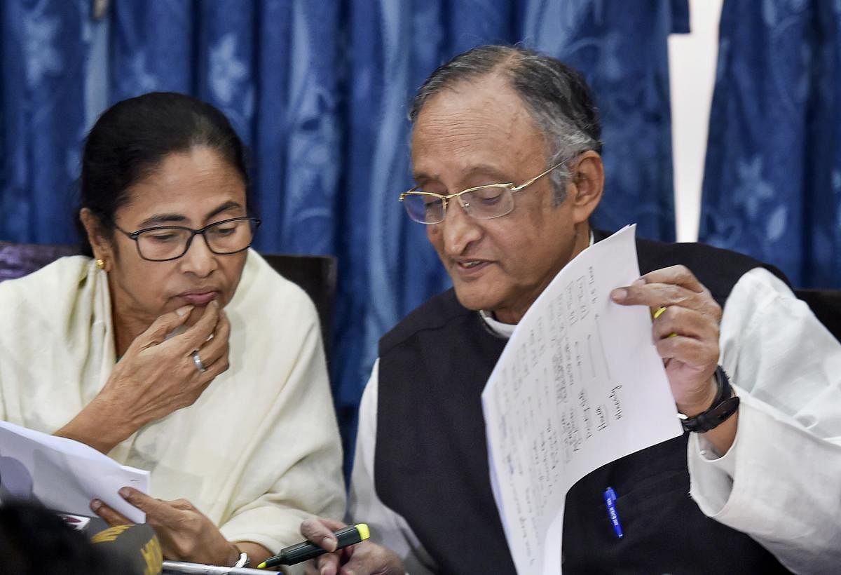  West Bengal Chief Minister Mamata Banerjee and Finance Minister Amit Mitra during a media interaction following the presentation of the State Budget 2020-21 in the State Assembly, in Kolkata, Monday, Feb. 10, 2020. Credit: PTI Photo