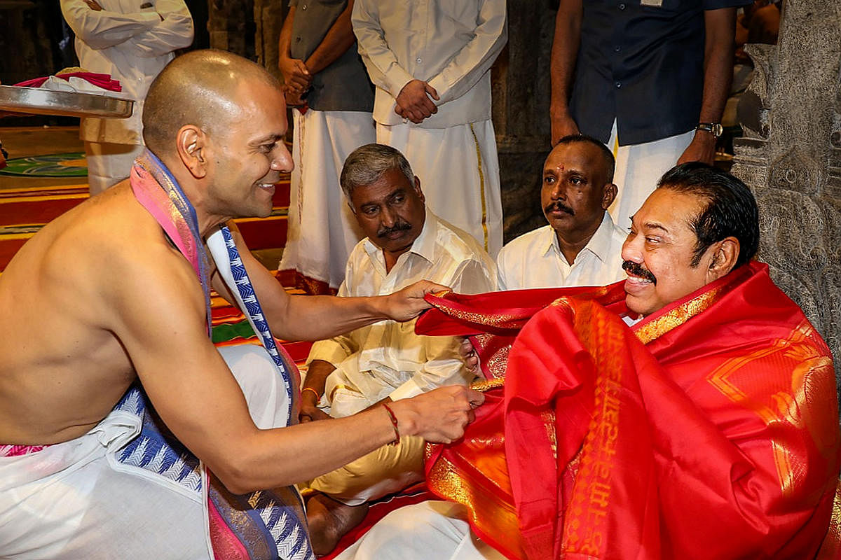 Sri Lankan Prime Minister Mahinda Rajapaksa is felicitated by Tirumala Tirupati Devasthanams (TTD) Executive Officer (EO) Anil Kumar Singhal during his visit at Tirumala Sri Venkateswara Temple in Chittoor district of Andhra Pradesh. (PTI Photo)