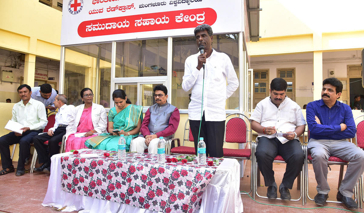 District In-charge Minister Kota Srinivas Poojary speaks after inaugurating a community service centre at Wenlock District Hospital in Mangaluru.
