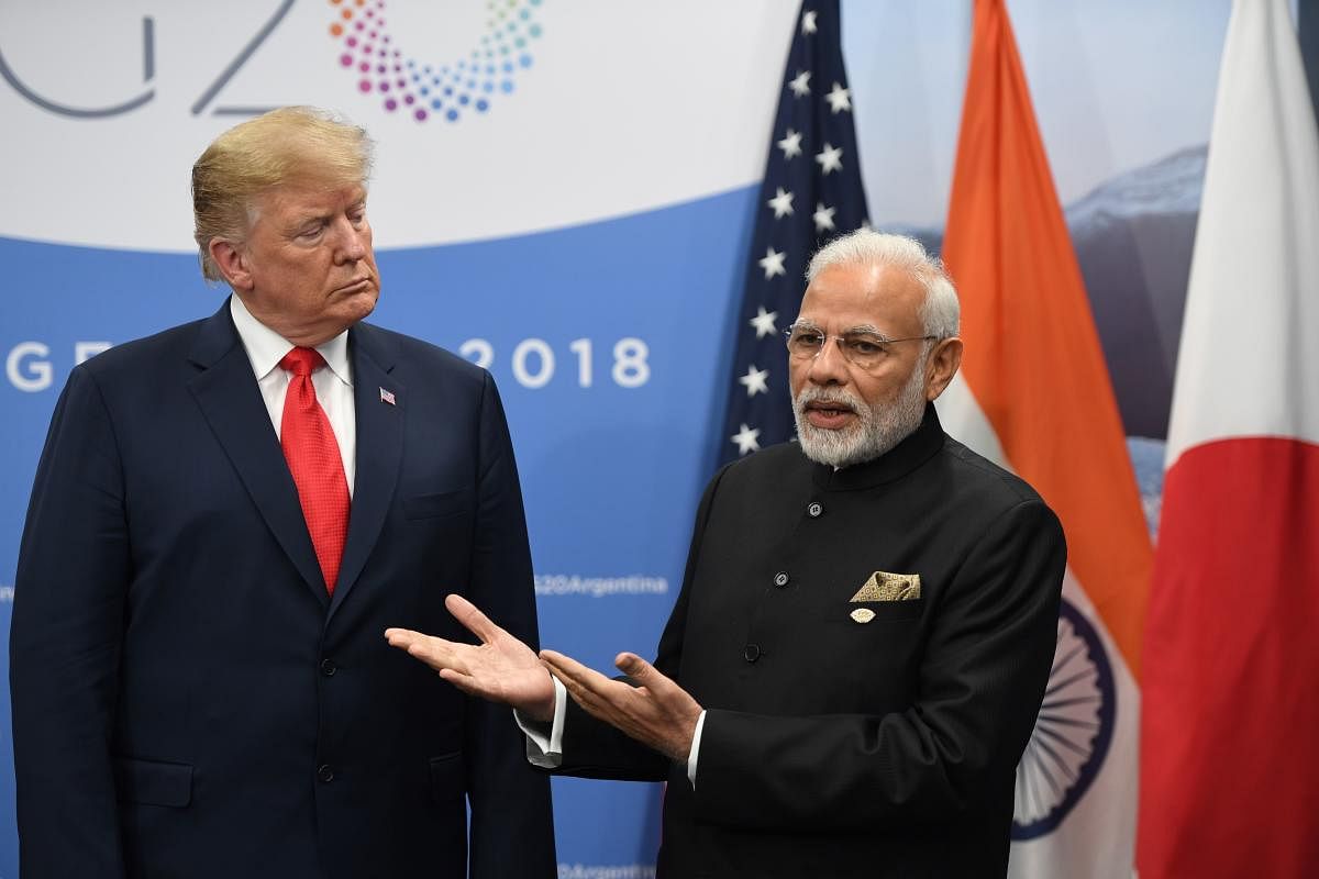 President Donald Trump listens to India's Prime Minister Narendra Modi during a meeting in the sidelines of the G20 Leaders' Summit in Buenos Aires, Argentina. (Credit: AFP Photo)