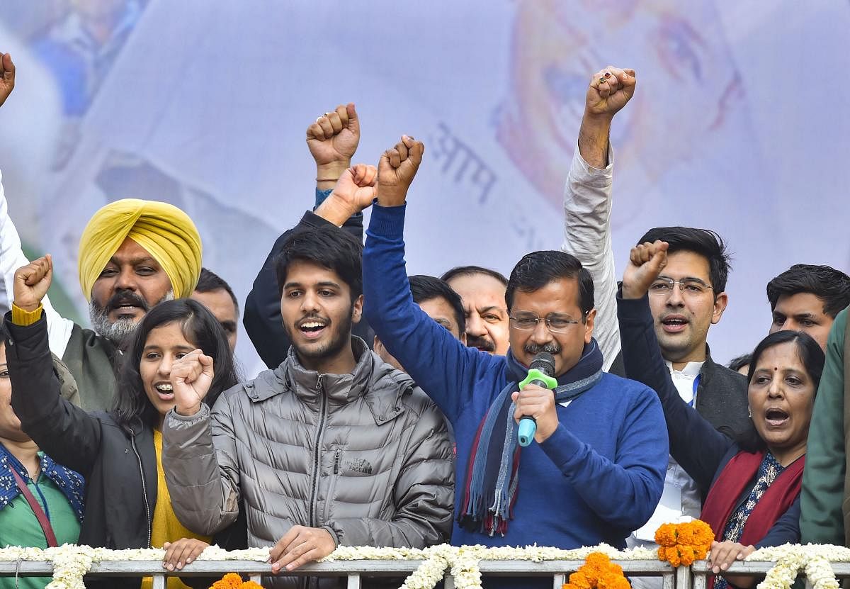  Delhi CM and AAP convenor Arvind Kejriwal (C) addreses supporters after party's victory in the State Assembly polls, at AAP office in New Delhi, Tuesday, Feb. 11, 2020. Kejriwal's wife Sunita, daughter Harshita and son Pulkit are also seen. (PTI Photo)