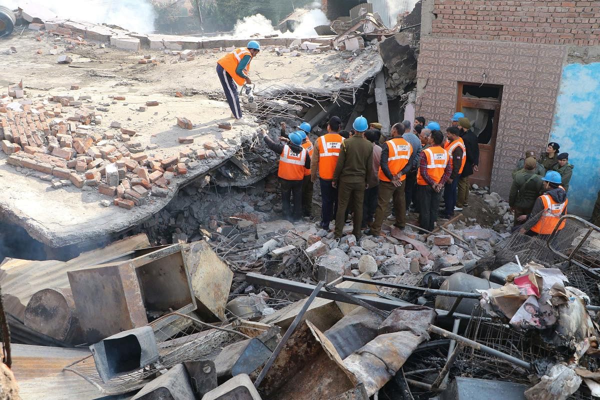 Rescue works underway after a three-storey building collapsed in Tallab Tillo area of Jammu, Wednesday, Feb. 12, 2020. (PTI Photo)