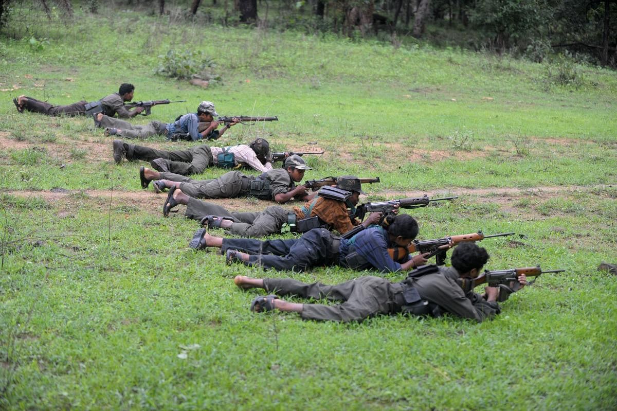 In this file photo taken on July 8, 2012 Indian Maoists ready their weapons as they take part in a training camp in Bijapur district in Chhattisgarh. (AFP Photo)
