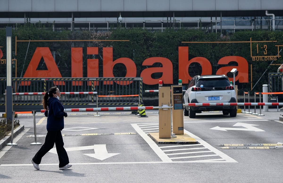 A woman jogs in front of the Alibaba headquarters in Hangzhou, some 175 kilometres (110 miles) southwest of Shanghai. AFP