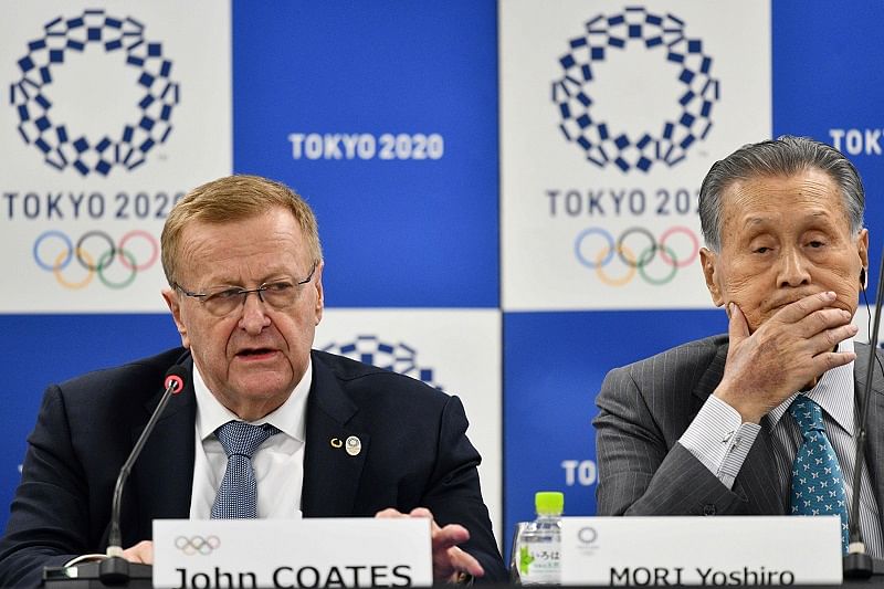 Chairman of the Tokyo 2020 Olympic Games coordination committee John Coates (L) and Tokyo 2020 president Yoshiro Mori (R) attend a press confernce following the International Olympic Committee (IOC) project review meeting in Tokyo. (AFP Photo)