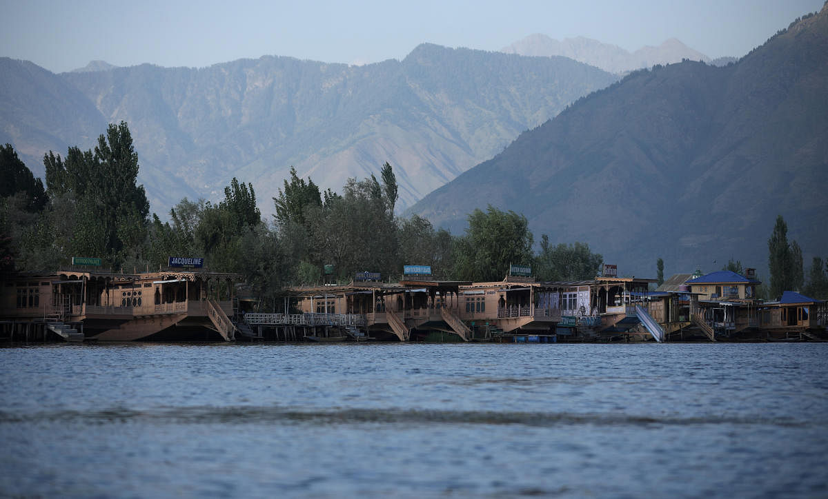 Empty houseboats are seen at Dal lake. (Reuters photo)