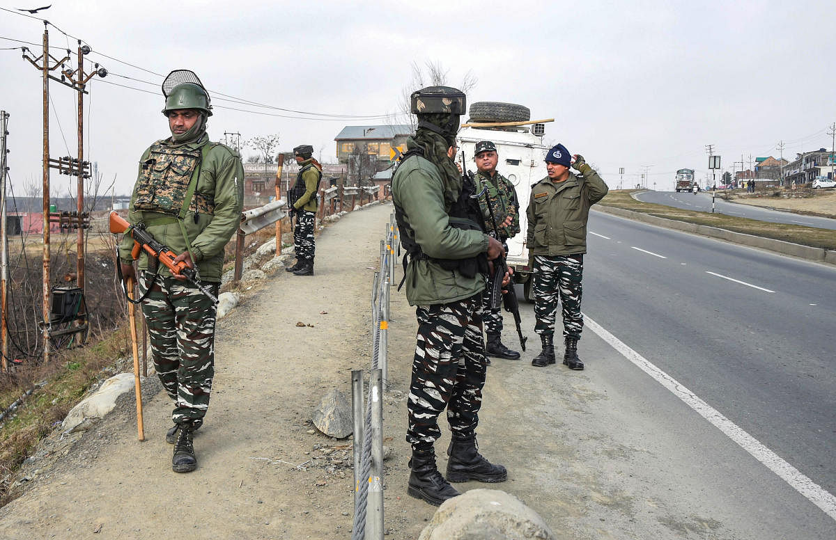 CRPF personnel stand guard at the spot where deadly 2019 Pulwama terror attack took place, at Lethipora of Pulwama District, South Kashmir. PTI
