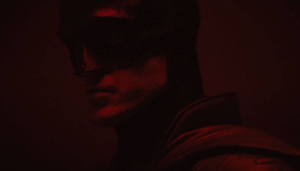 In the short clip, Pattinson, dressed as the caped crusader, is approaching towards the camera that is set in a dark room saturated in red light.