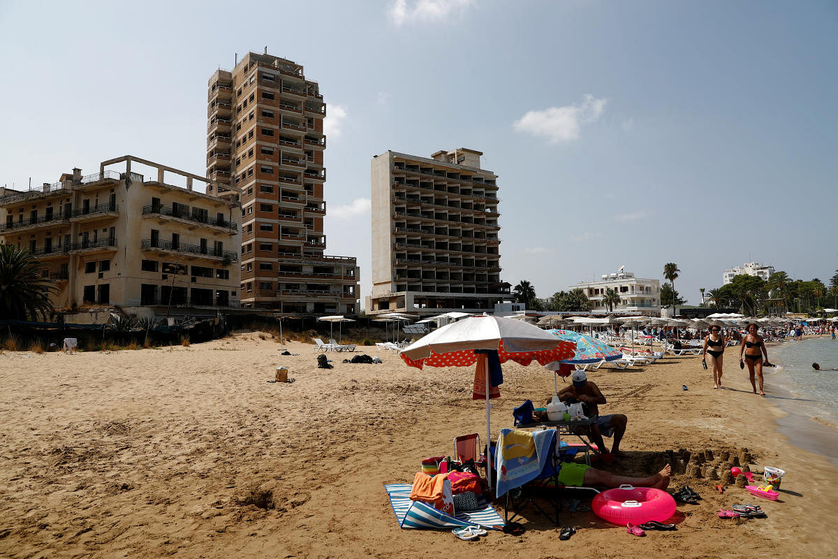 Abandoned buildings in Varosha, an area fenced off by the Turkish military since the 1974 division of Cyprus, are seen from a beach in Famagusta. (Reuters file photo)