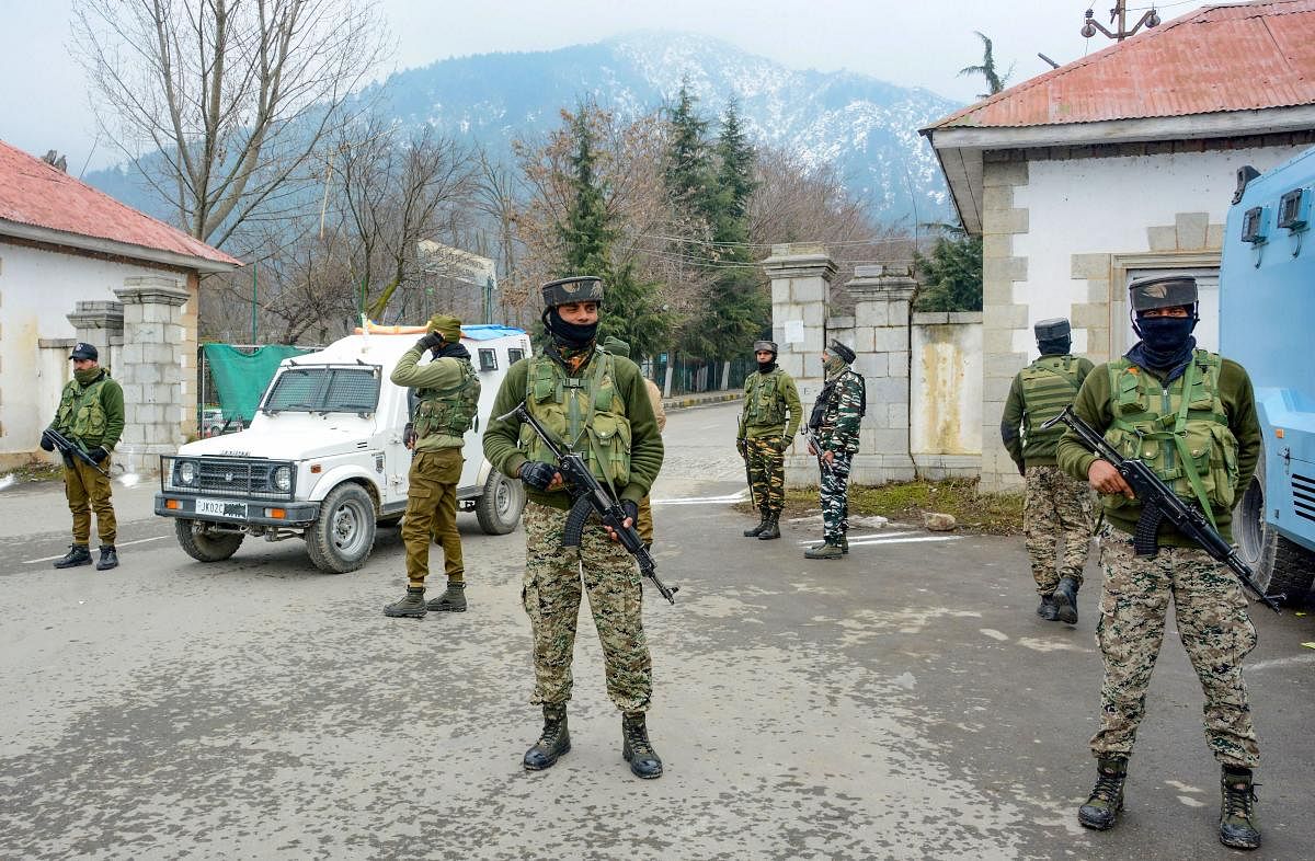 Security personnel stand guard outside the hotel where 25 European Union Parliamentarians were staying and meeting people during their visit to assess the ground situation in Valley after the abrogation of Article 370, in Srinagar, Wednesday, Feb. 12, 202