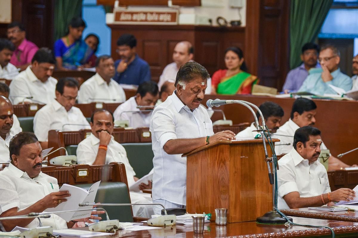 Tamil Nadu Deputy Chief Minister and Finance Minister O Panneerselvam presents the state budget for 2020-21 at Assembly in Chennai, Friday, Feb. 14, 2020. Chief Minister Edappadi K. Palaniswami is also seen. (PTI Photo)
