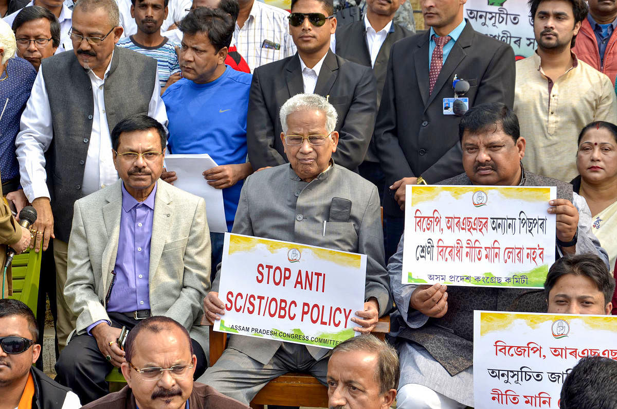 Former Assam chief minister Tarun Gogoi takes part in a protest demanding the restoration of the reservation policy for the Scheduled Castes, Scheduled Tribes and the Other Backward Classes (OBCs) organized by Assam Pradesh Congress Committee(APCC), in Gu